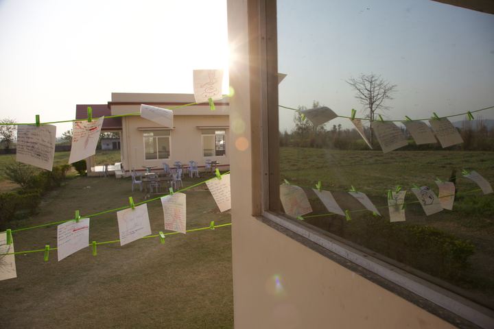Drawings pegged on a line outside a window, Rishikesh