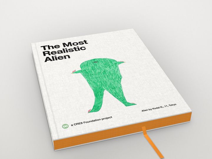 The Most Realistic Alien, Vol. 1: a white cloth book with saffron edges and a saffron ribbon; on its cover drawing No. 2, Kodai N., 11, Tokyo 2012