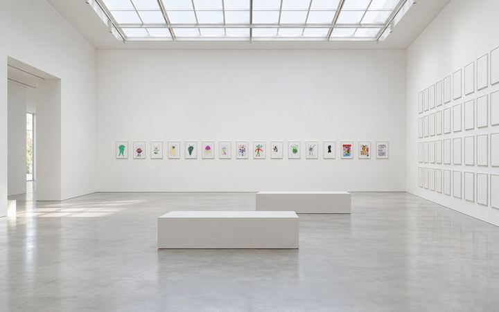Imagined: A white gallery with one row of sixteen framed drawings